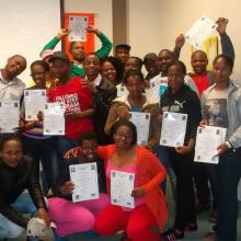 The library’s 2012 intermediate computer and job readiness trainees celebrate their graduation.