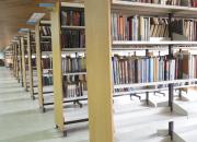 rows of book shelves in a library