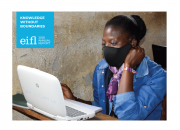 Cover image of the EIFL 2020 Annual Report showing a young woman, wearing a coronavirus protective mask, using a computer in a Ugandan village library.