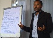 An open access policy workshop participant presents group work results - and open access policy draft for Addis Ababa University
