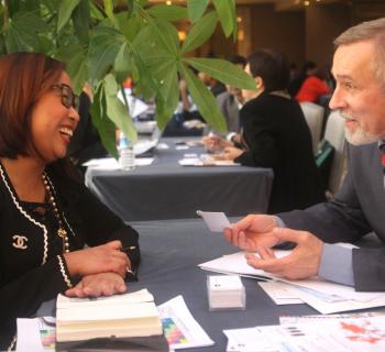 An EIFL publisher partner and an EIFL Coordinator from Belarus share a laugh during discussions. 