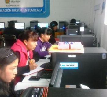 People using computers in Public Library 'Victoria Dorantes' No. 382, which serves the Atotonilco community in Tlaxo municipality in south-central Mexico.