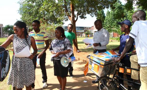 Student open access campaigners at Harare Institute of Technology used a megaphone to broadcast messages and a bicycle to distribute pamphlets during Open Access Week 2015. Photo by Jasper Lee Maenzanise.